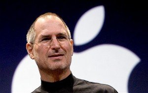 Steve Jobs rules for success led him to the top. Here he is at an Apple event, standing in front of the Apple logo.